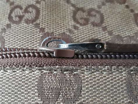 how does the zipper on gucci bags work|gucci counterfeit bags.